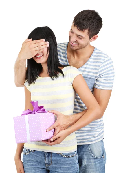 Beautiful loving couple with gift isolated on white — Stock Photo, Image