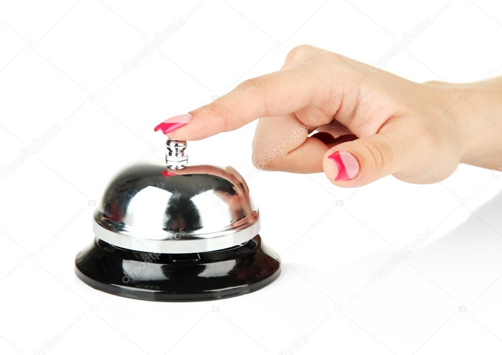 Female hand ringing in service bell isolated on white