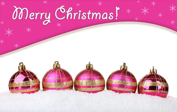 Beautiful pink Christmas balls in snow — Stock Photo, Image