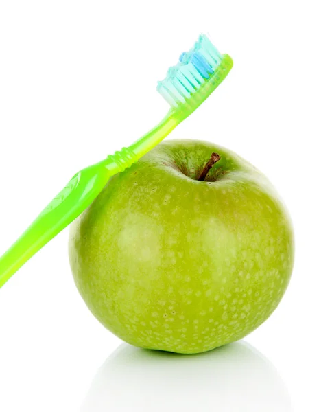 Apple with a toothbrush isolated on white — Stock Photo, Image