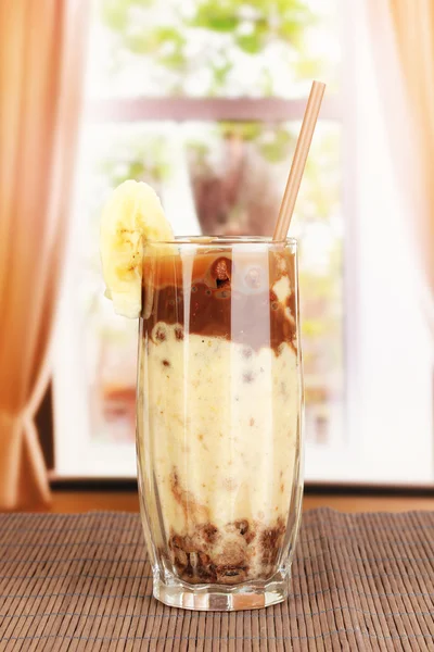 Delicious fruit smoothie on window background — Stock Photo, Image