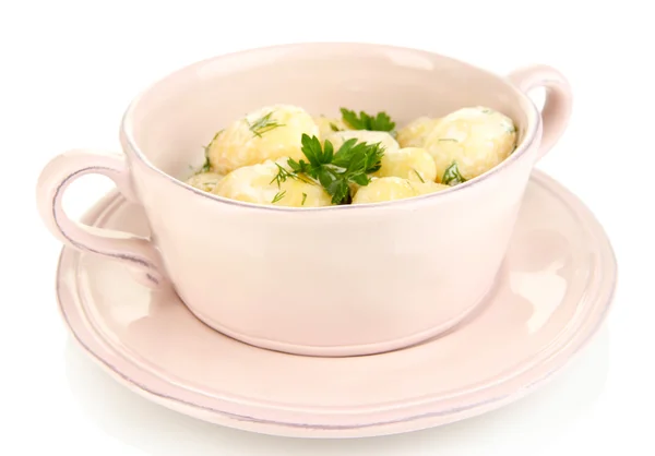 Tender young potatoes with sour cream and herbs in pan isolated on white — Stock Photo, Image