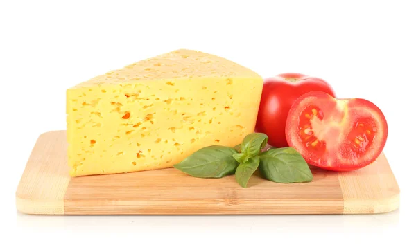 Cheese,basil and tomato on cutting board isolated on white — Stock Photo, Image