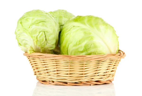 Green cabbage in wicker basket, isolated on white — Stock Photo, Image