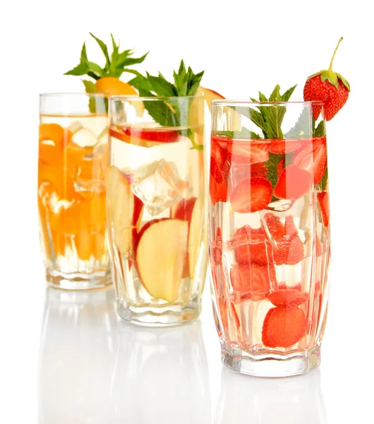 Glasses of fruit drinks with ice cubes isolated on white — Stock Photo, Image