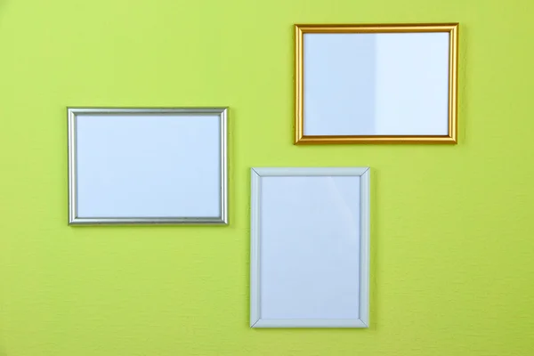 Photo frames on wall background — Stock Photo, Image