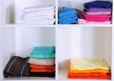 Clothes neatly folded on shelves