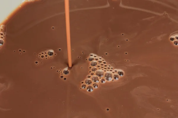 Pouring chocolate close-up — Stock Photo, Image