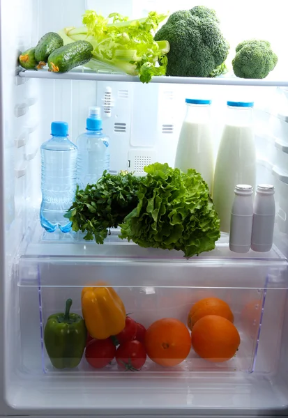 Open refrigerator with vegetarian food — Stock Photo, Image