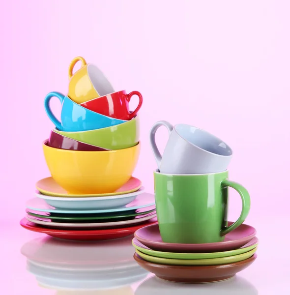 Mountain colorful dishes on pink background — Stock Photo, Image