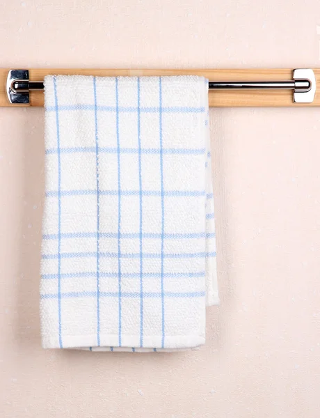 Bath towel on crossbar in room — Stock Photo, Image