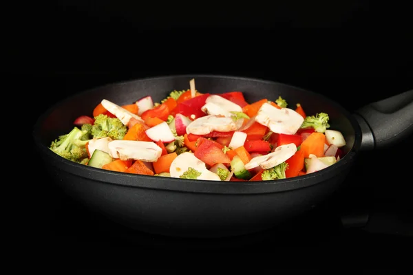 Vegetable ragout in pan, isolated on black — Stock Photo, Image