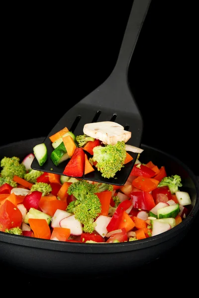 Vegetable ragout in pan, isolated on black — Stock Photo, Image