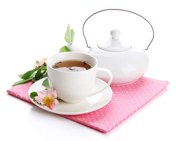 Cup and teapot of herbal tea with hip rose flowers, isolated on white — Stock Photo, Image