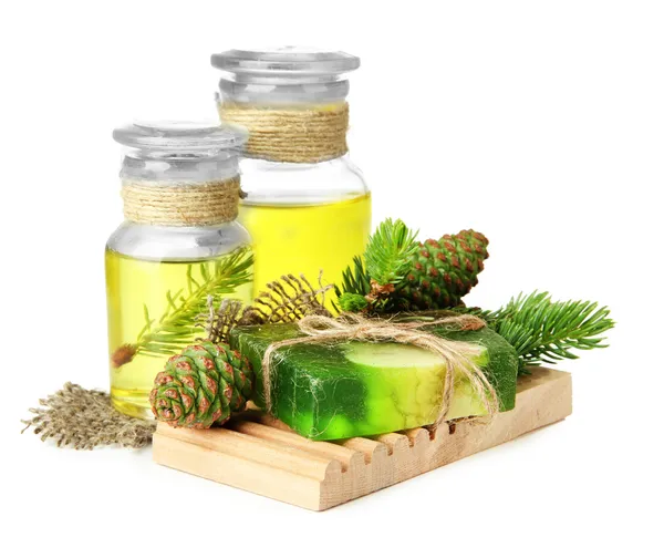 Hand-made soap and bottles of fir tree oil, isolated on white — Stock Photo, Image