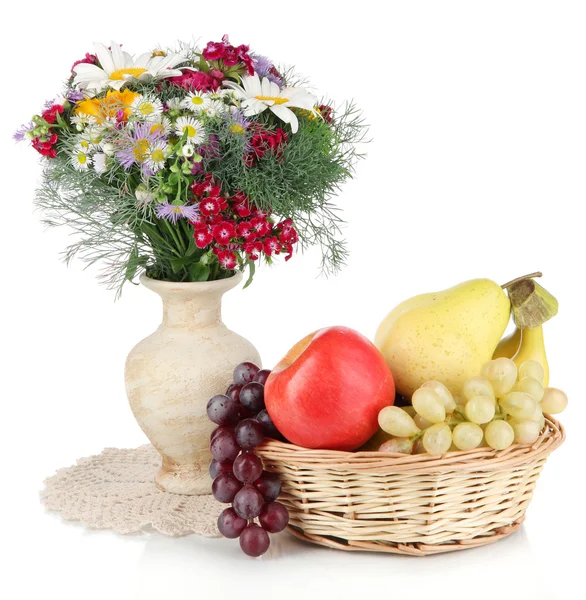Beautiful bright flowers in vase with fruits isolated on white — Stock Photo, Image