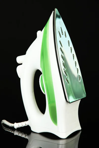 Steam iron isolated on black — Stock Photo, Image