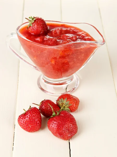 Homemade strawberry jam, on color wooden background — Stock Photo, Image