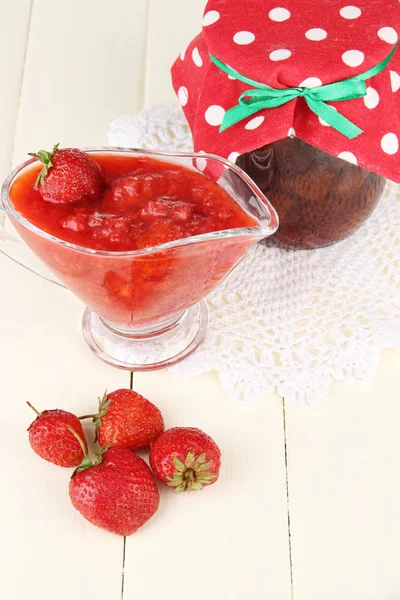 Homemade strawberry jam, on color wooden background — Stock Photo, Image