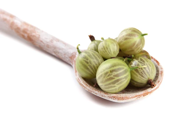 Gooseberry in wooden spoon isolated on white — Stock Photo, Image
