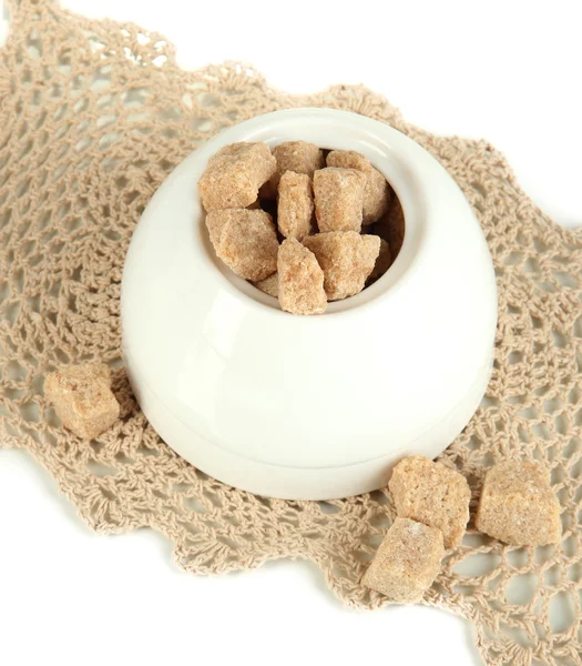 Unrefined sugar in white sugar bowl on grey background — Stock Photo, Image