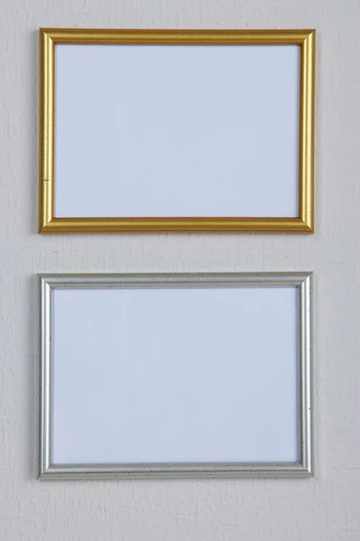 Photo frames on wall background — Stock Photo, Image