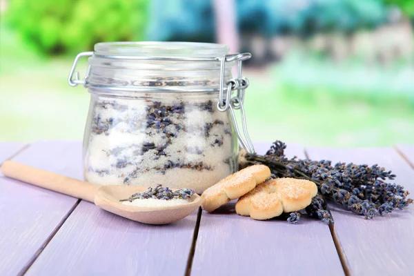 Jar of lavender sugar and fresh lavender flowers on bright background — Stock Photo, Image