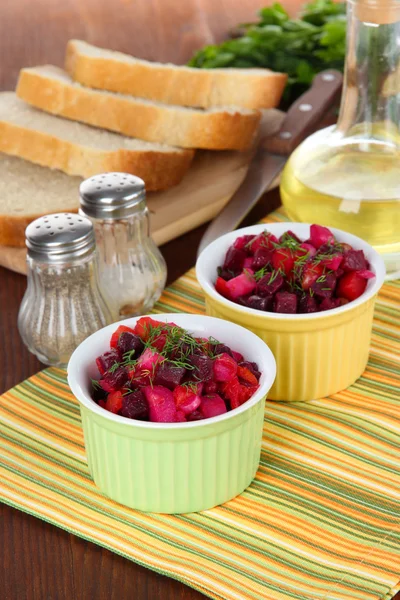 Beet salad in bowls on table close-up — Stock Photo, Image