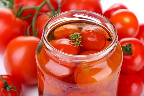 Open glass jar of tasty canned tomatoes, close up — Stock Photo, Image