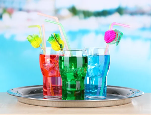 Different cocktails on bright background — Stock Photo, Image