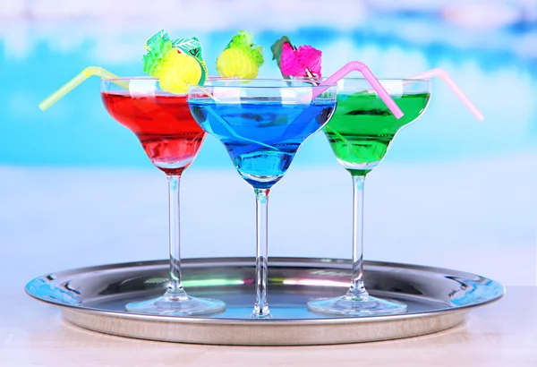 Different cocktails on bright background — Stock Photo, Image