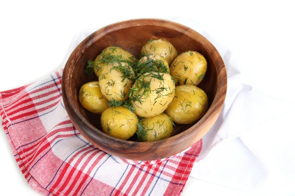 Boiled potatoes on wooden bowl on napkins isolated on white — Stock Photo, Image