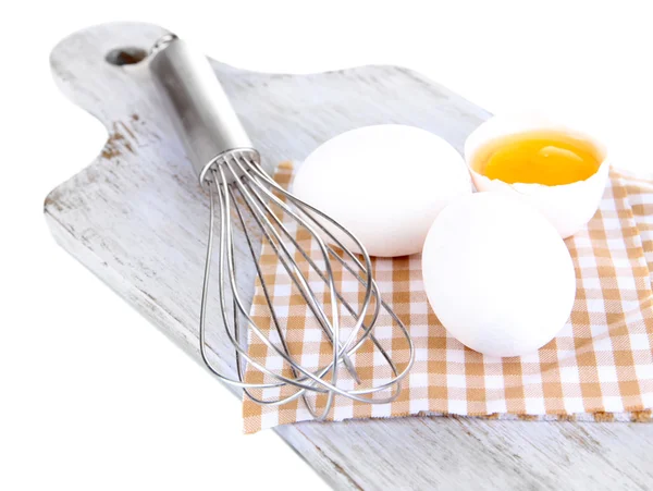 Corolla and eggs on wooden board isolated on white — Stock Photo, Image