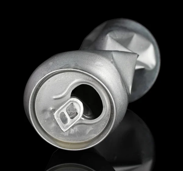 Crumpled empty can isolated on black — Stock Photo, Image