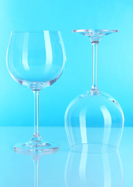 Two glasses on light blue background — Stock Photo, Image