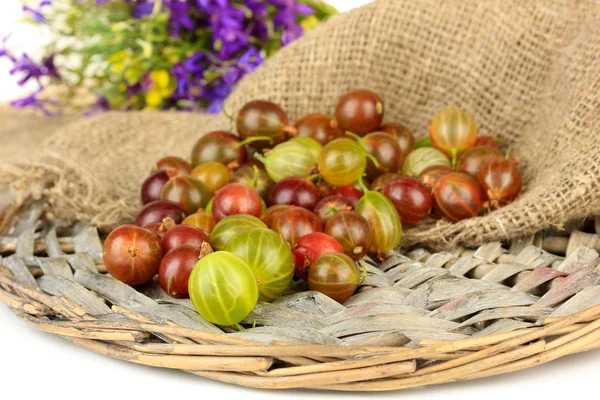 Fresh gooseberries on wicker mat close-up — Stock Photo, Image