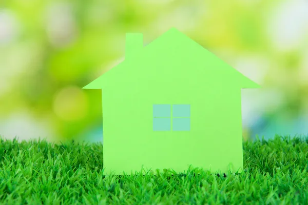 Paper house on grass on natural background — Stock Photo, Image