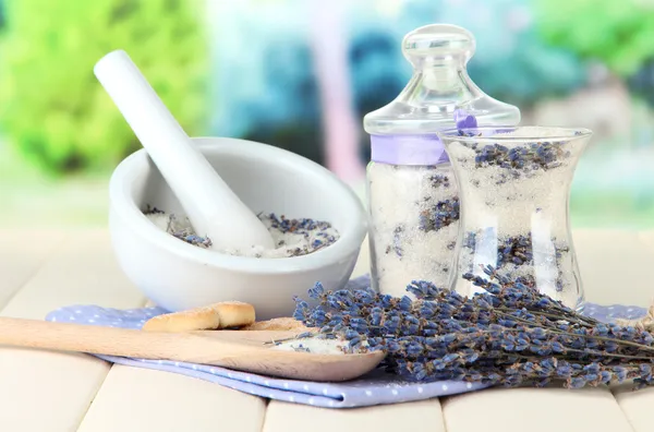 Still life with jar of lavender sugar, mortar and fresh lavender flowers on bright background — Stock Photo, Image