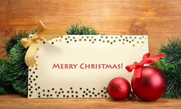Vackra jul sammansättning med vykort på trä bakgrund — Stockfoto