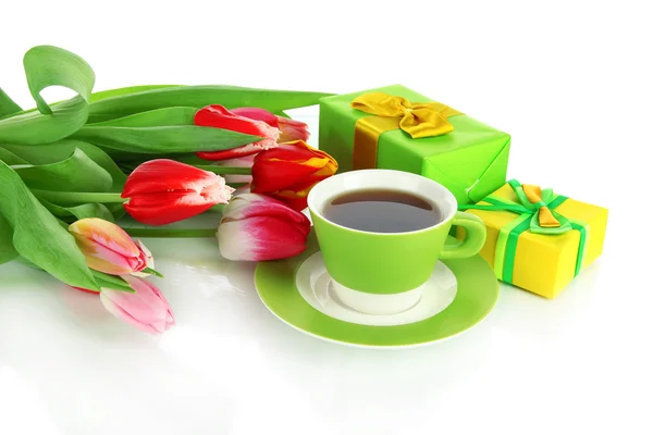 Beautiful tulips in bucket with gifts and cup of tea isolated on white — Stock Photo, Image