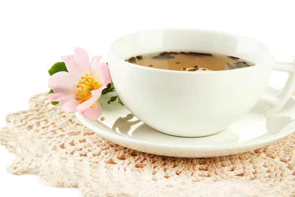 Cup of herbal tea with hip rose flowers, isolated on white — Stock Photo, Image