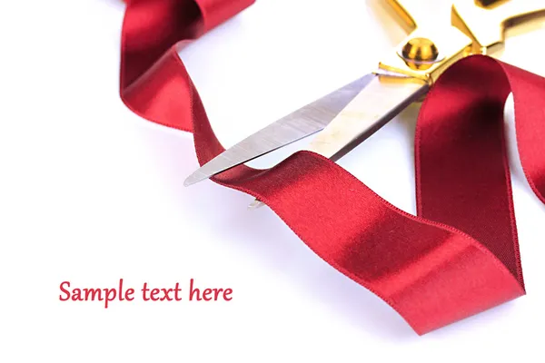 Satin ribbon curled around scissors isolated on white — Stock Photo, Image