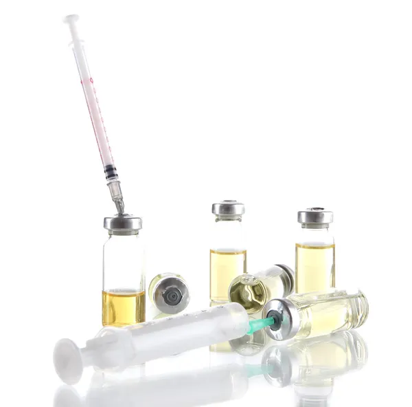 Medical bottles tablets and syringes isolated on white — Stock Photo, Image