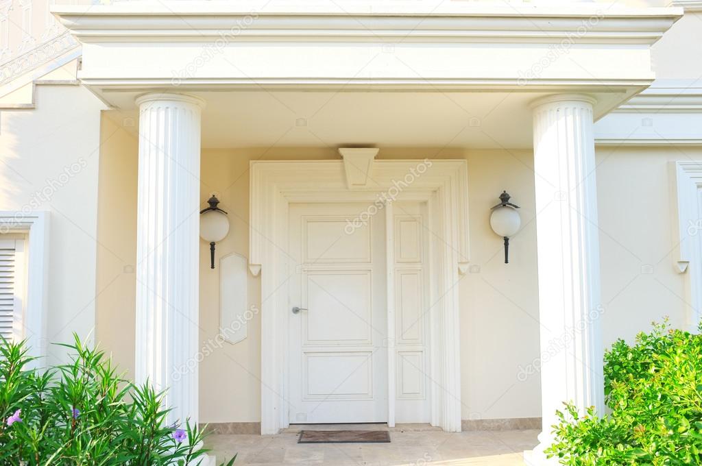 White front door of house with columns