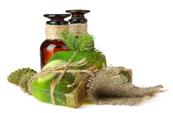 Hand-made soap and bottles of fir tree oil, isolated on white — Stock Photo, Image