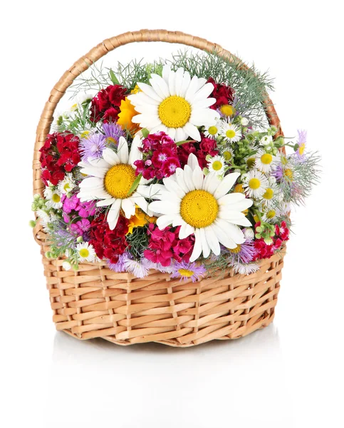 Beautiful bright flowers in wicker basket isolated on white — Stock Photo, Image