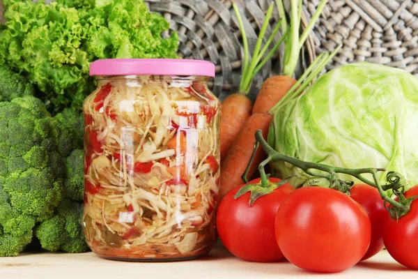 Fresh vegetables and canned on wooden table close up — Stock Photo, Image