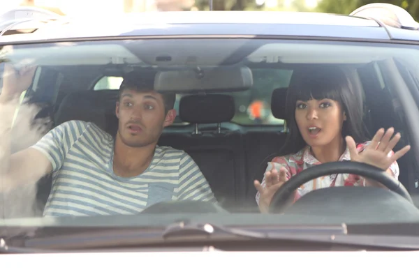 Scared woman shouts driving the car — Stock Photo, Image