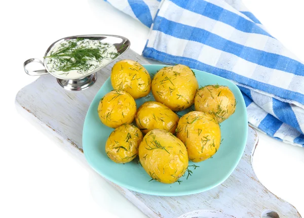 Boiled potatoes on platen on wooden board on napkin isolated on white — Stock Photo, Image