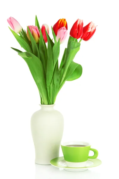 Beautiful tulips in bucket with cup of tea isolated on white Stock Image